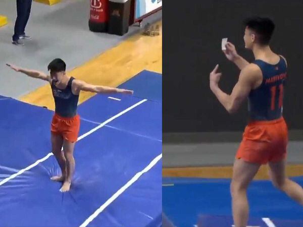 Gymnast celebrates vault success by brandishing ...