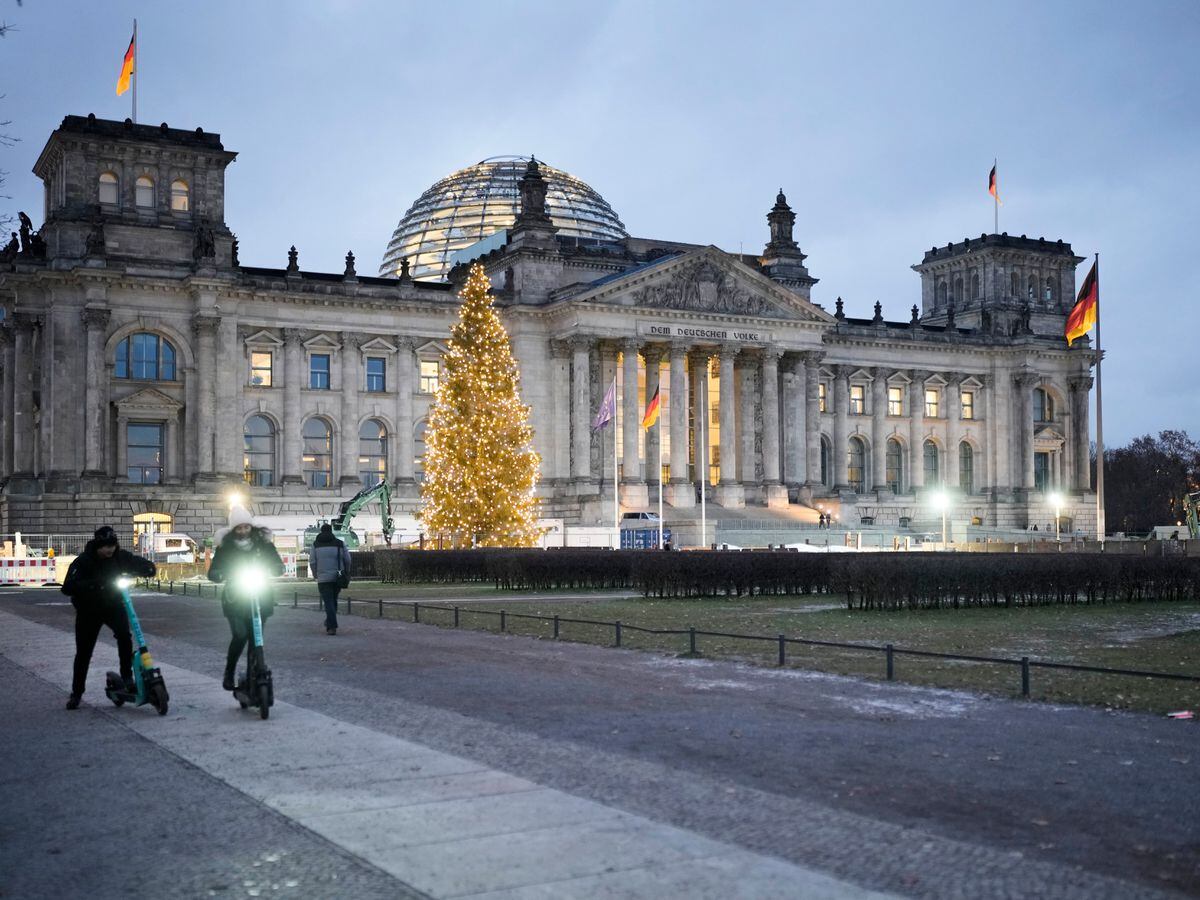 Reichstag with German parliament Bundestag illuminated in Berlin, Germany