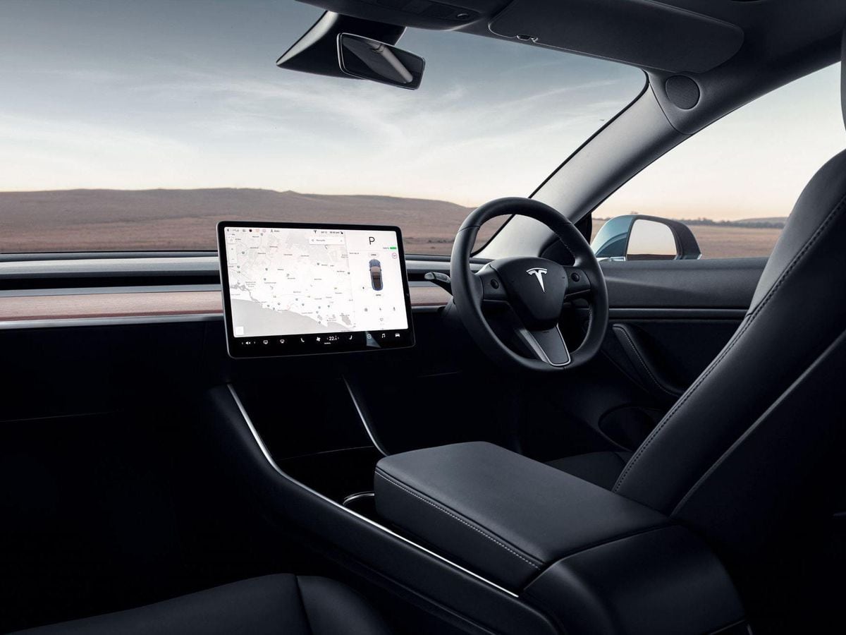 Tesla touchscreen should be treated as a distracting electronic device ...