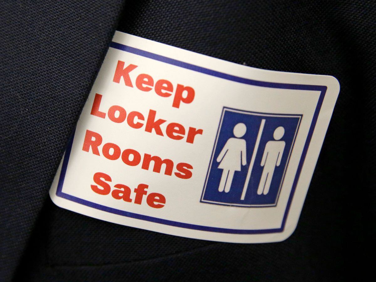 A sticker that reads, 'Keep Locker Rooms Safe'