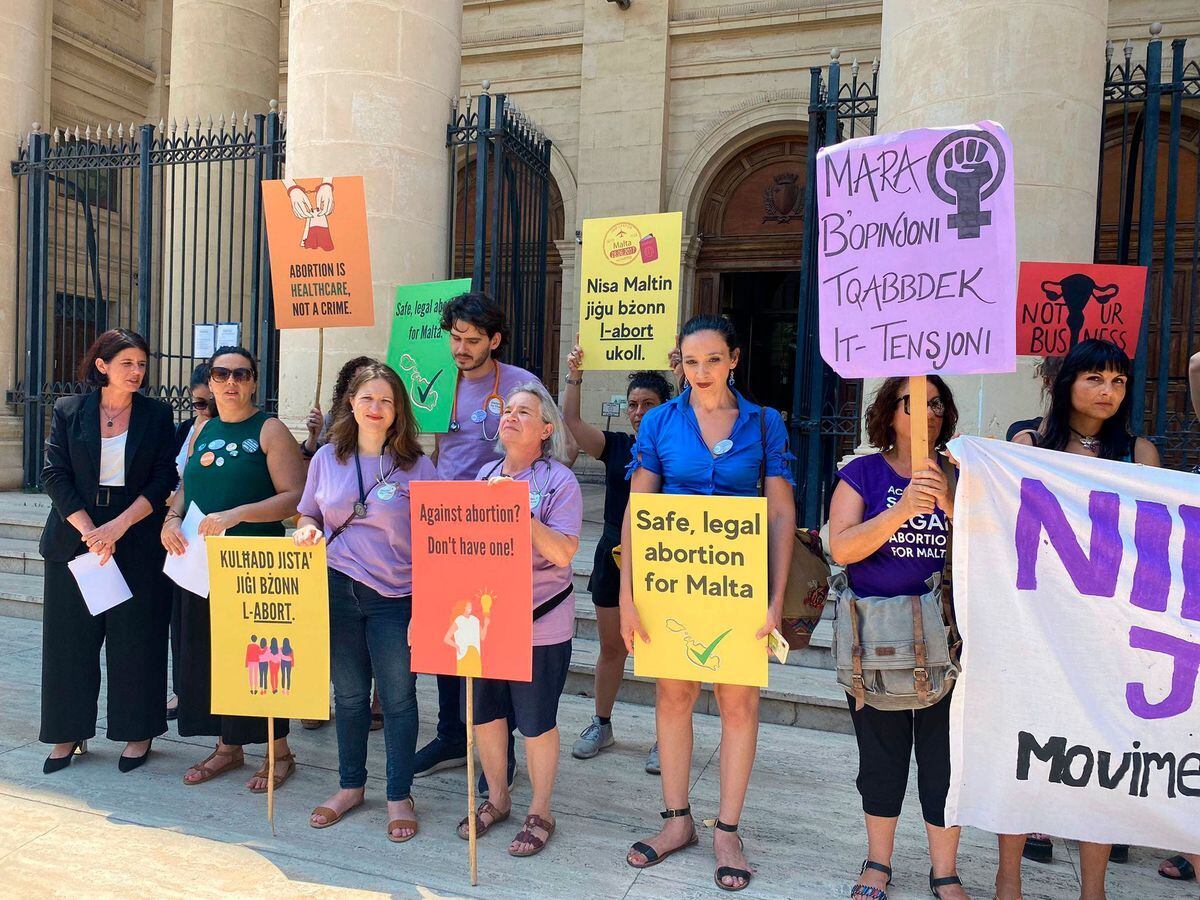 Activists outside the Maltese law courts