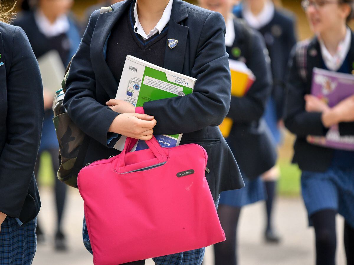 Uk Covid. Change Schools. A picture of a student carrying a Bag. Admission to High School.