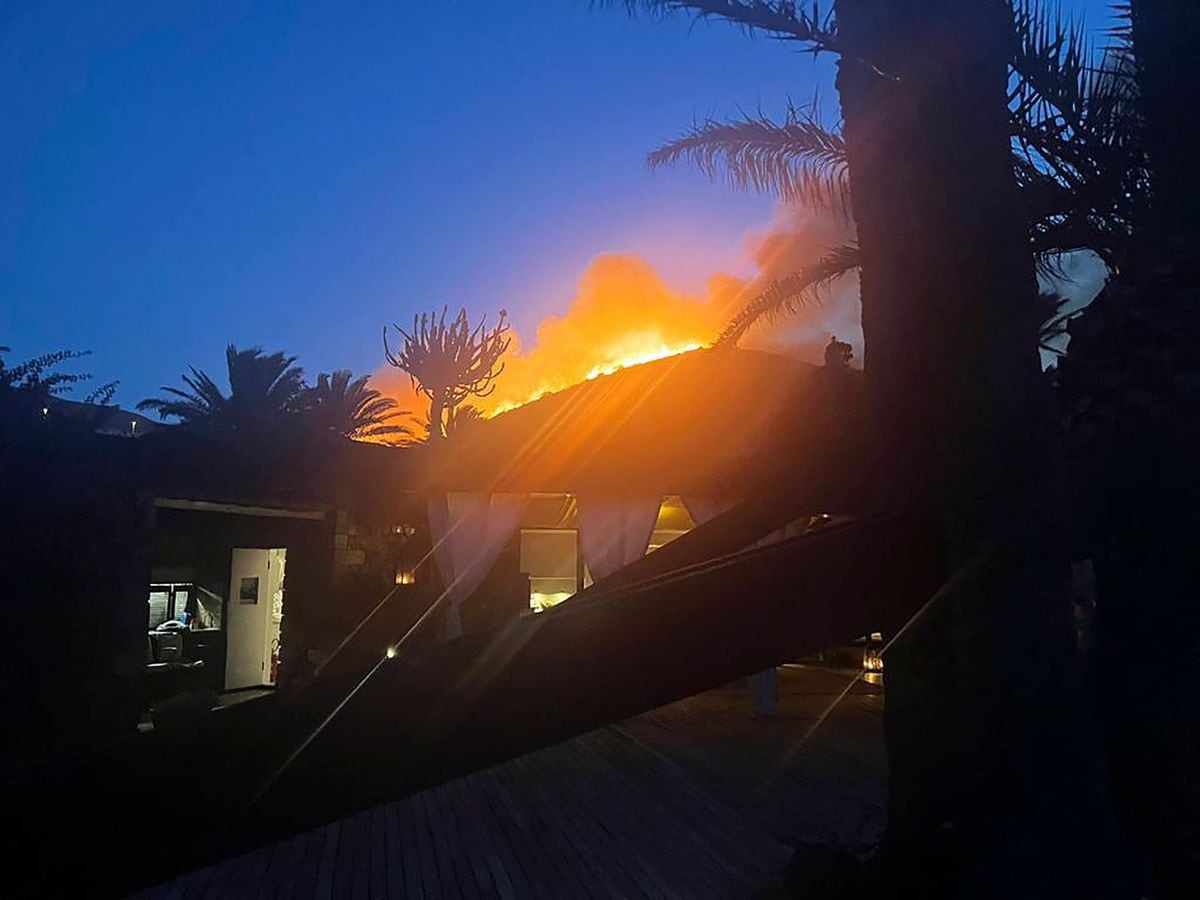 Flames burn beyond Giorgio Armani’s villa on the Sicilian island of Pantelleria