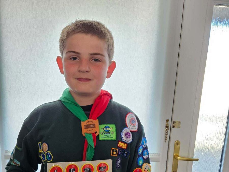 Boy, 10, Celebrates Achieving All 57 Cubs Badges 