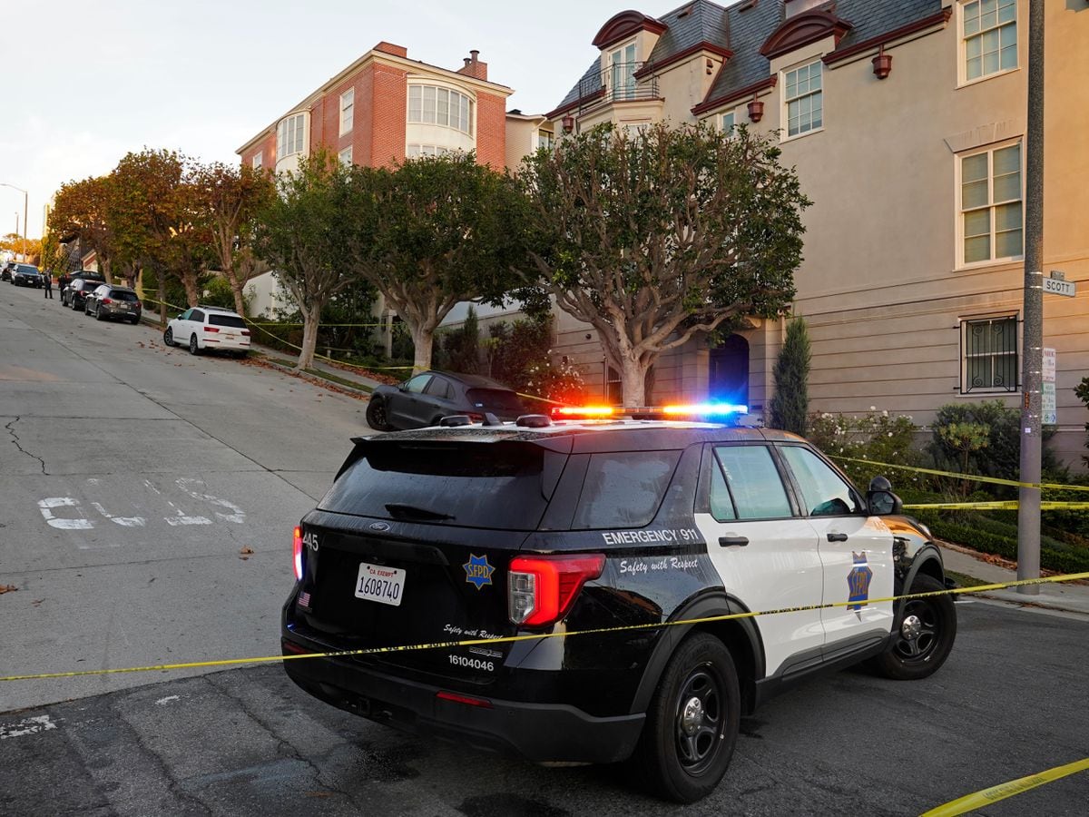 A police car blocks the street below Paul Pelosi's house