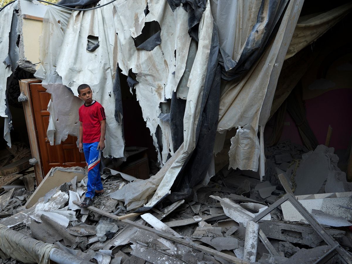 Mohamed Alada destroys rubble of his home in Israeli airstrike in Rafah refugee camp in southern Gaza Strip