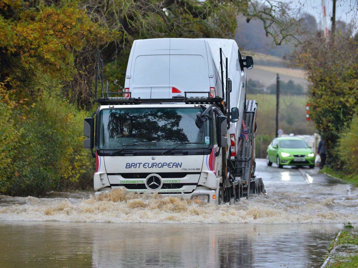Flood warnings in place, schools closed and cars stranded as Shropshire ...