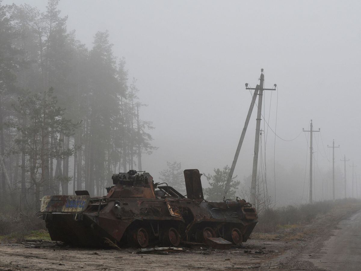 A destroyed Russian military vehicle is seen near the recently recaptured Ukrainian village of Yampil