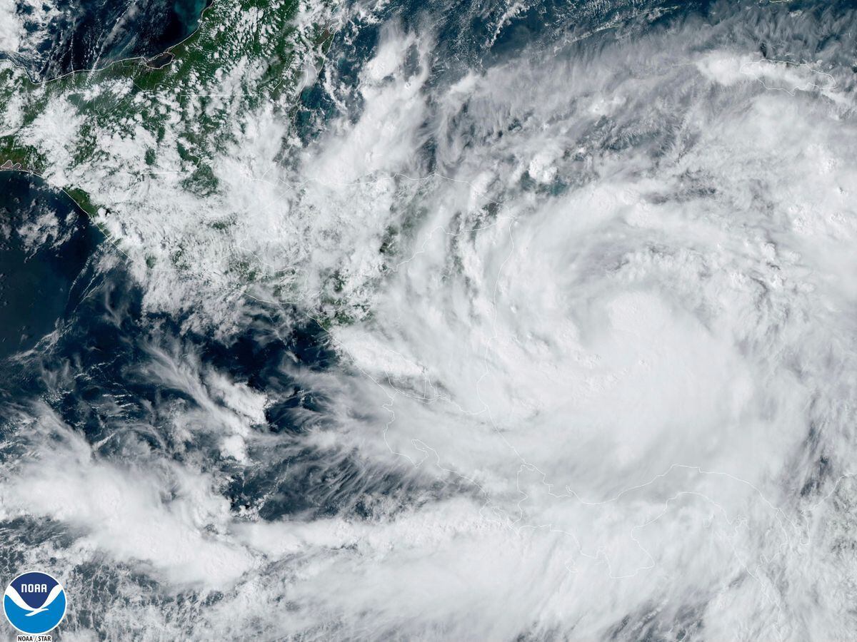 Satellite imagery of Saturday, October 8, 2022, provided by NOAA shows Tropical Storm Julia in the lower right corner at 4 p.m. ET