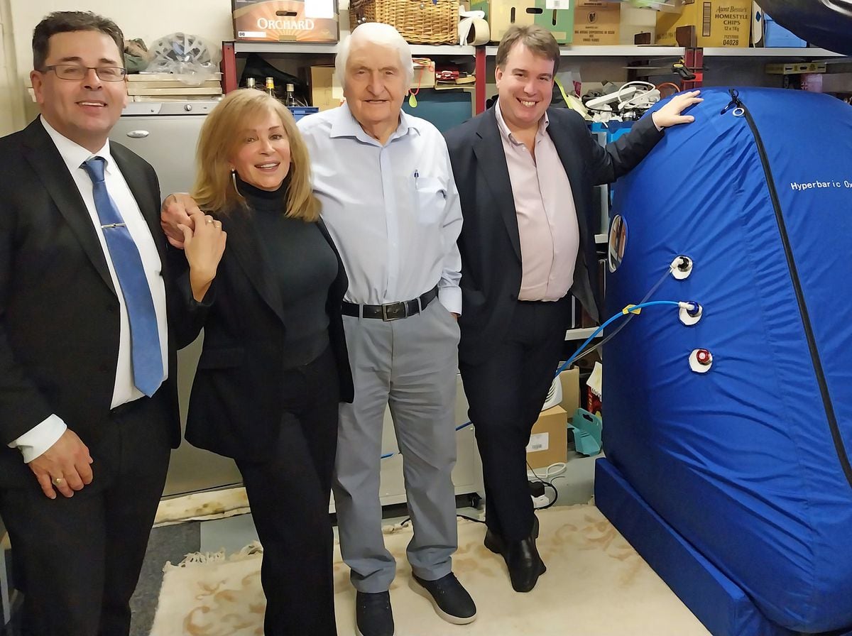 Montgomeryshire MP Craig Williams (right), Patrick Riley, Georgina Clifford and Peter Webber with a hyperbaric oxygen chamber.