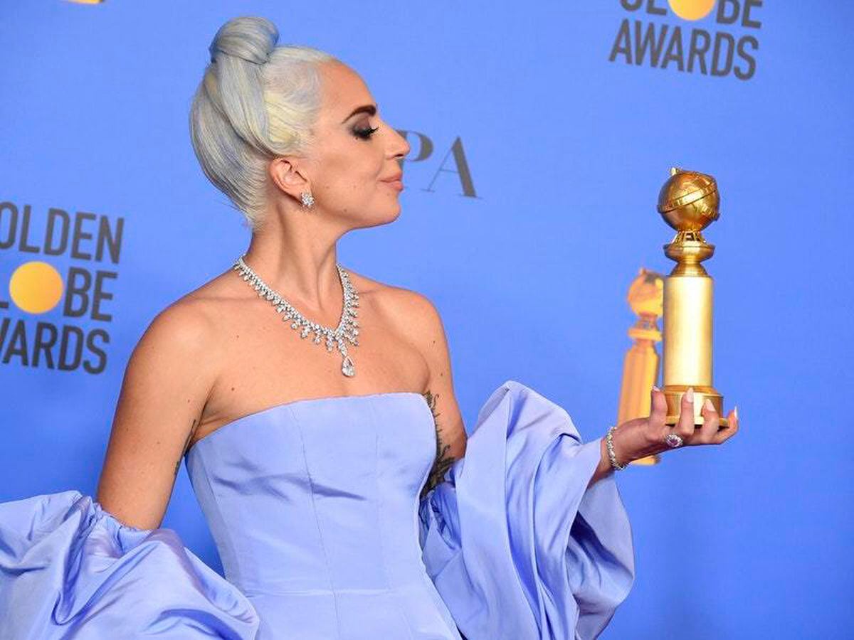 Lady Gaga pays tribute to Bradley Cooper as she picks up best song