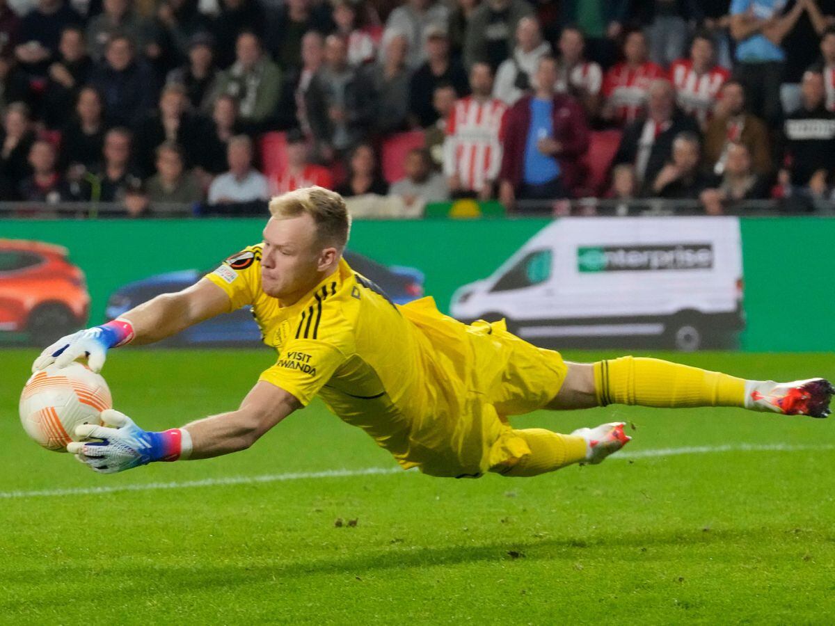 Arsenal goalkeeper Aaron Ramsdale appears to be kicked by