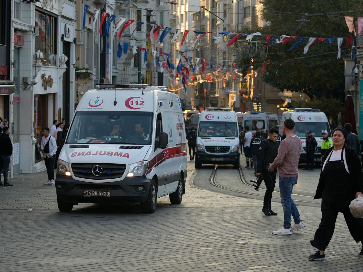 Security and ambulances at the scene following the explosion on Istiklal Avenue in Istanbul