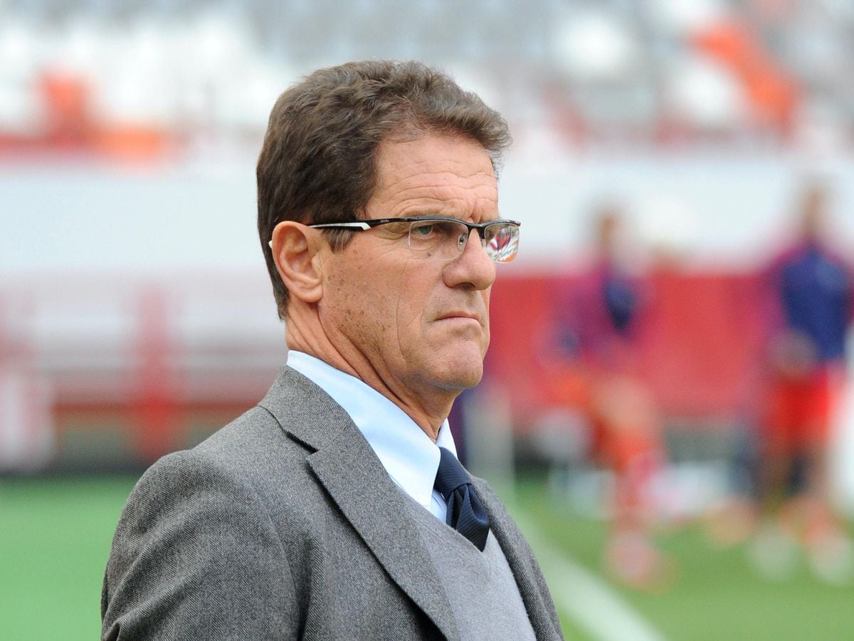  Fabio Capello, the coach of the England team, looking on during the match against Slovenia at the 2010 World Cup in South Africa.