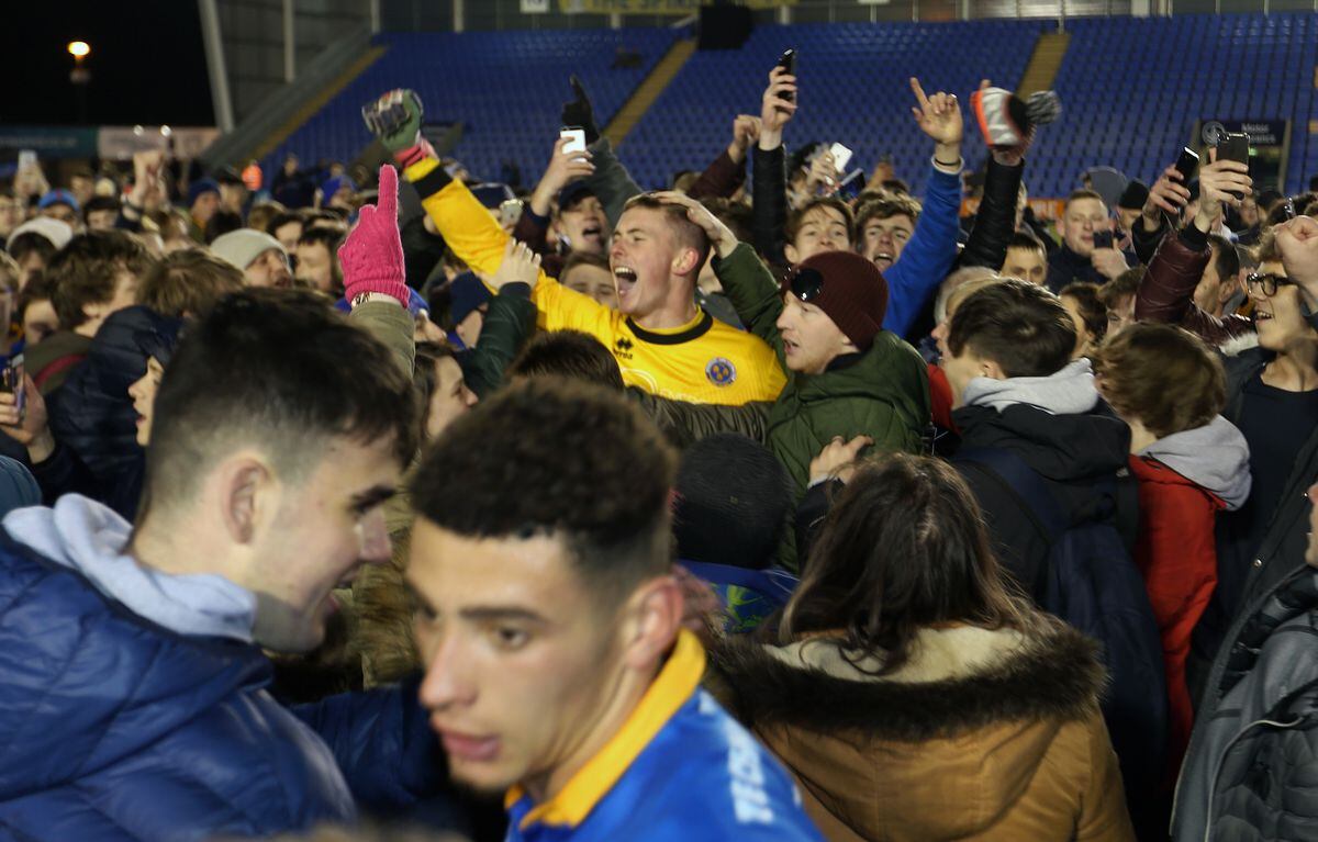 Fans and players celebrate Shrewsbury Town's Checkatrade Trophy success ...