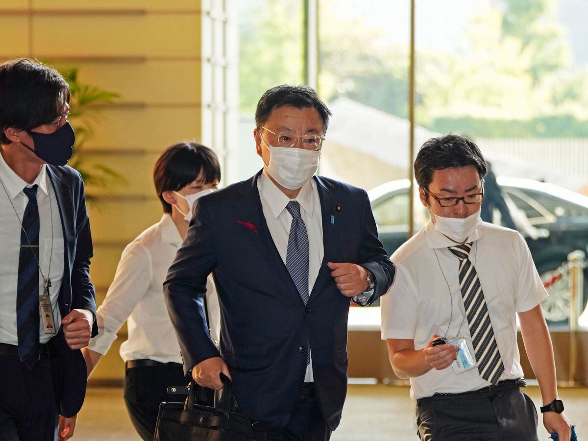 Japanâs Chief Cabinet Secretary Hirokazu Matsuno, center, arrives at the prime ministerâs office in Tokyo Tuesday, Oct. 4, 2022