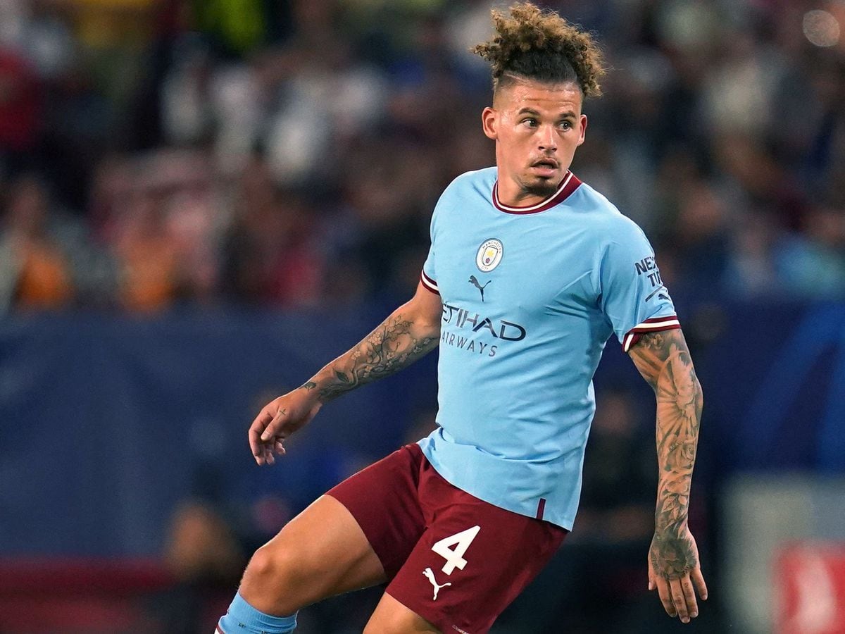  Kalvin Phillips playing soccer for Manchester City, wearing a blue jersey and red shorts.