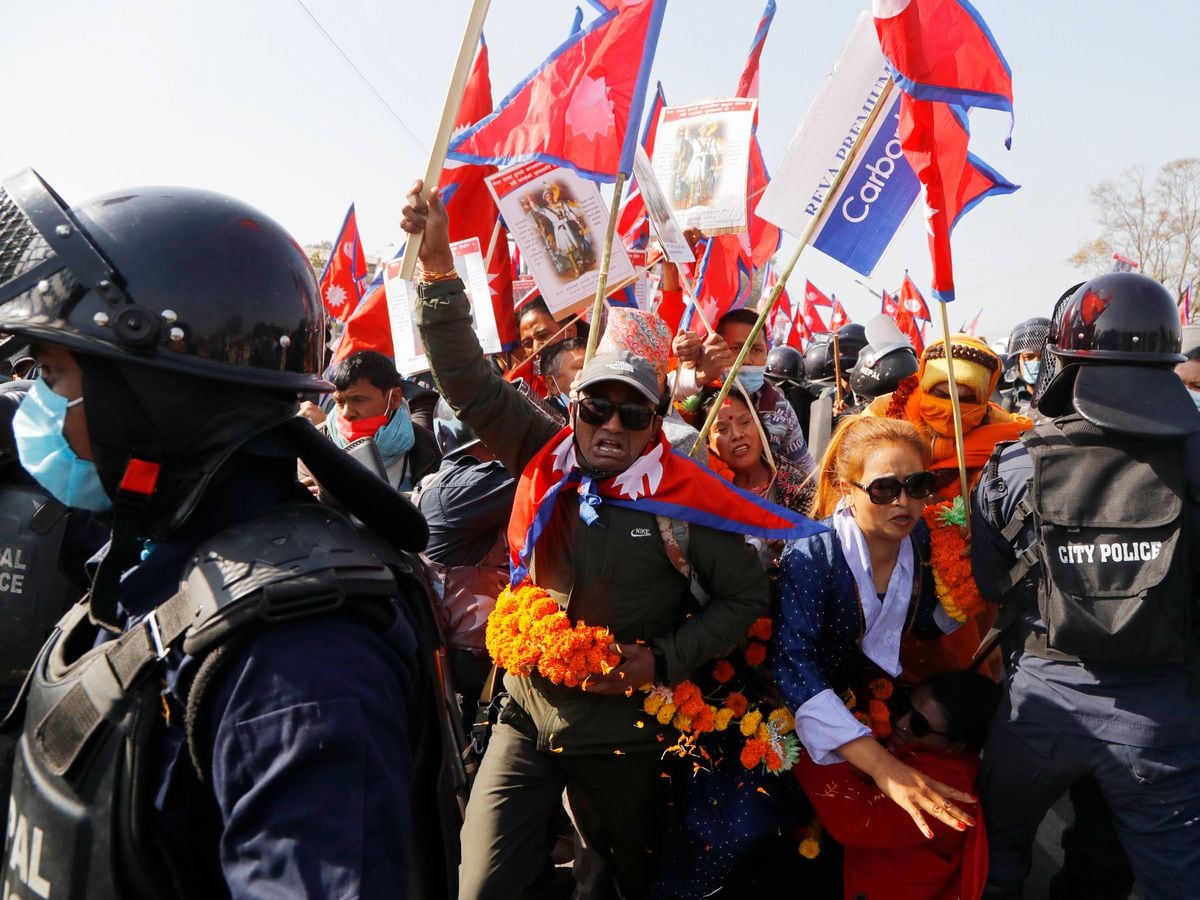 Riot police clash with protesters calling for return of Nepal’s ...