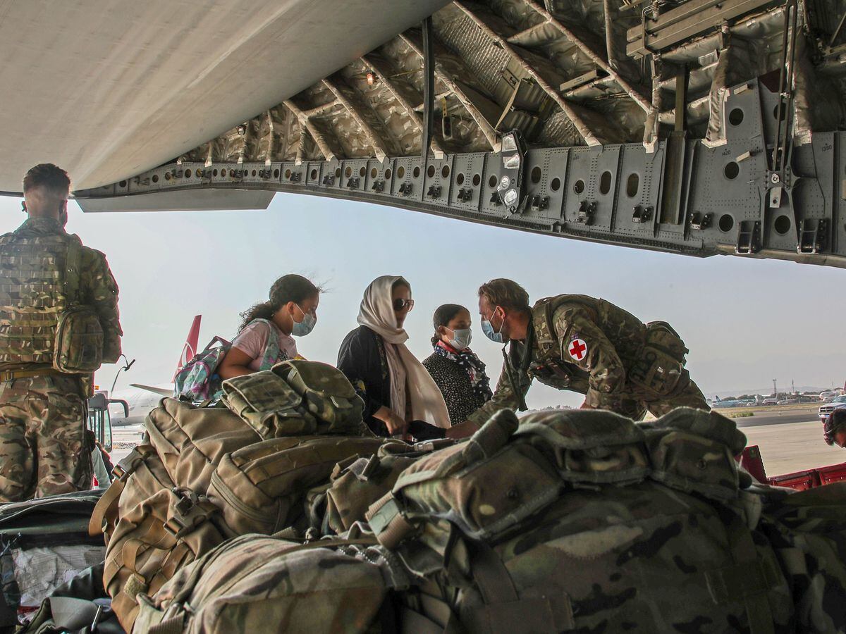 British citizens and dual nationals board a RAF flight out of Kabul