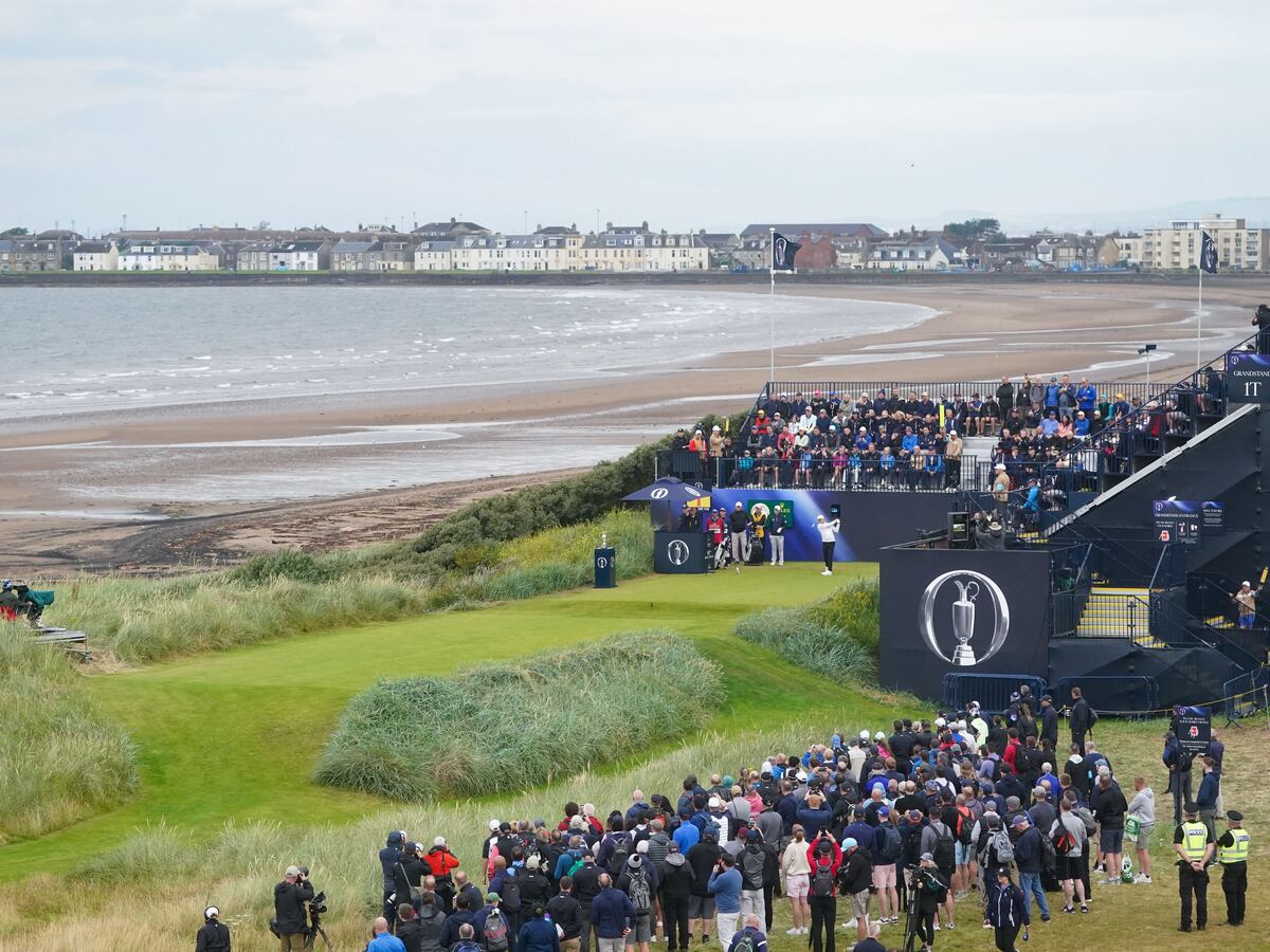 Justin Leonard hits the first shot of the 152nd Open at a cloudy Troon