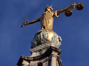 The gold statue of Lady Justice on top of the Old Bailey