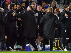 Southampton manager Russell Martin, left, and Brighton boss Fabian Hurzeler, far right, react at full-time