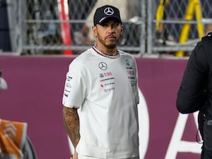 Lewis Hamilton stands on the grid