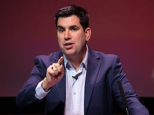 Richard Burgon gestures while speaking