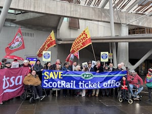 Protesters with banners outside the Scottish Parliament