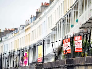 To Let signs on railings outside terraced houses