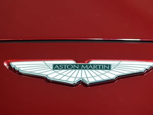 Aston Martin logo on a red car