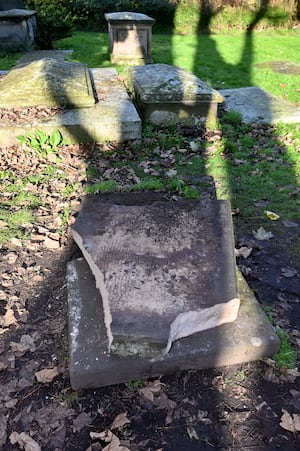 The damaged gravestone