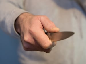 A person holding a knife