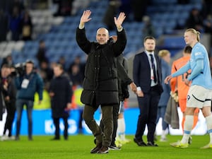 Pep Guardiola celebrates his side's win at Leicester