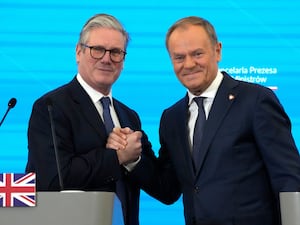 Prime Minister Sir Keir Starmer and Polish Prime Minister Donald Tusk shake hands after a press conference in Warsaw