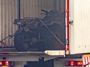 Quad bike loaded into back of a police vehicle