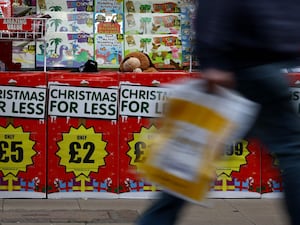 Adverts for Christmas goods in a shop window