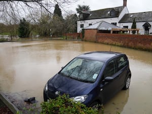 A car in a flooded car park