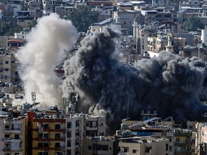 Smoke rises after an Israeli air strike on Dahiyeh, in the southern suburb of Beirut