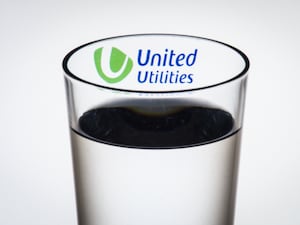 Glass of water with United Utilities logo