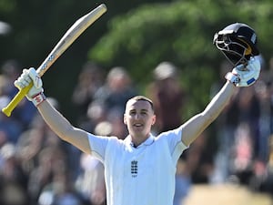 England’s Harry Brook celebrates after reaching his century