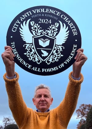 Clive Knowles – Holding Scotland’s Anti Violence Charter Plaque