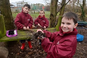 Alfie Bennett, Callum Green, and Declan Wyke, learning in Wilfred Owen Primary School's 'forest school'. Picture: Steve Leath