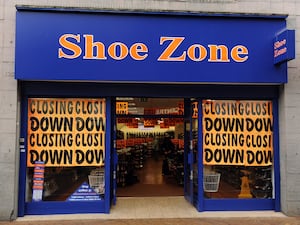 Retailer Shoe Zone revealed it has shut stores in response to soaring wage costs following the recent Budget measures as it warned over profits once again.