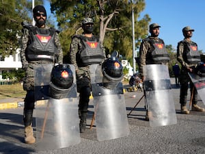 Paramilitary soldiers stand guard along roadside to ensure security in Islamabad