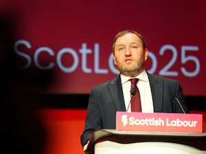 Ian Murray speaking from a lectern with Scottish Labour written on it