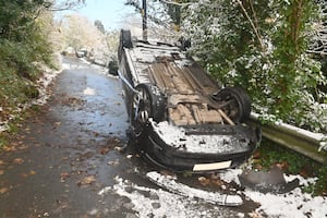 The car that has come down the very steep Lincoln Hill in Ironbridge and ended up on its roof.