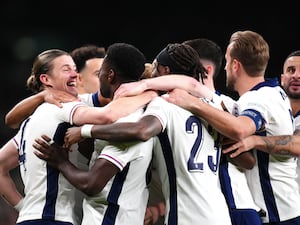 England celebrate in a huddle at Wembley