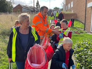 A community clean-up on the Treowen housing estate in Newtown which was organised as part of Caru Powys and included children from Treowen Primary School.