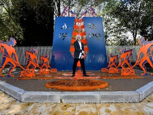 The sculpture commemorating Abraham Darby, with sculptor Steve Field, near his birthplace in Dudley